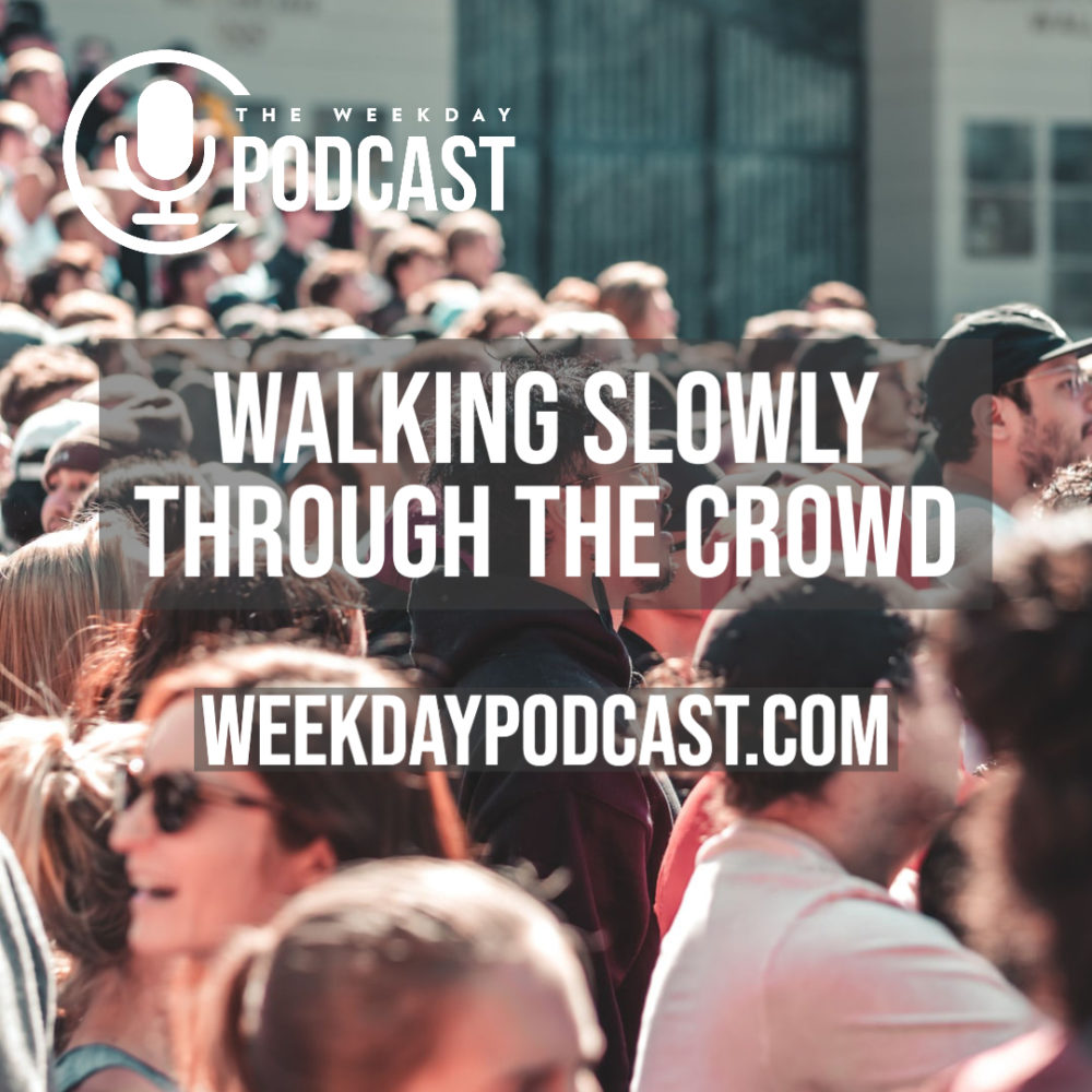 Walking Slowly Through The Crowd Image